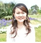 野口真代氏の笑顔のポートレート