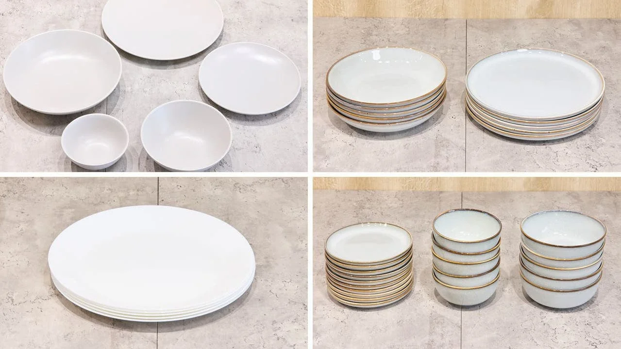 様々なサイズの無地の白い皿とボウル、金色の縁取りがある皿とボウル