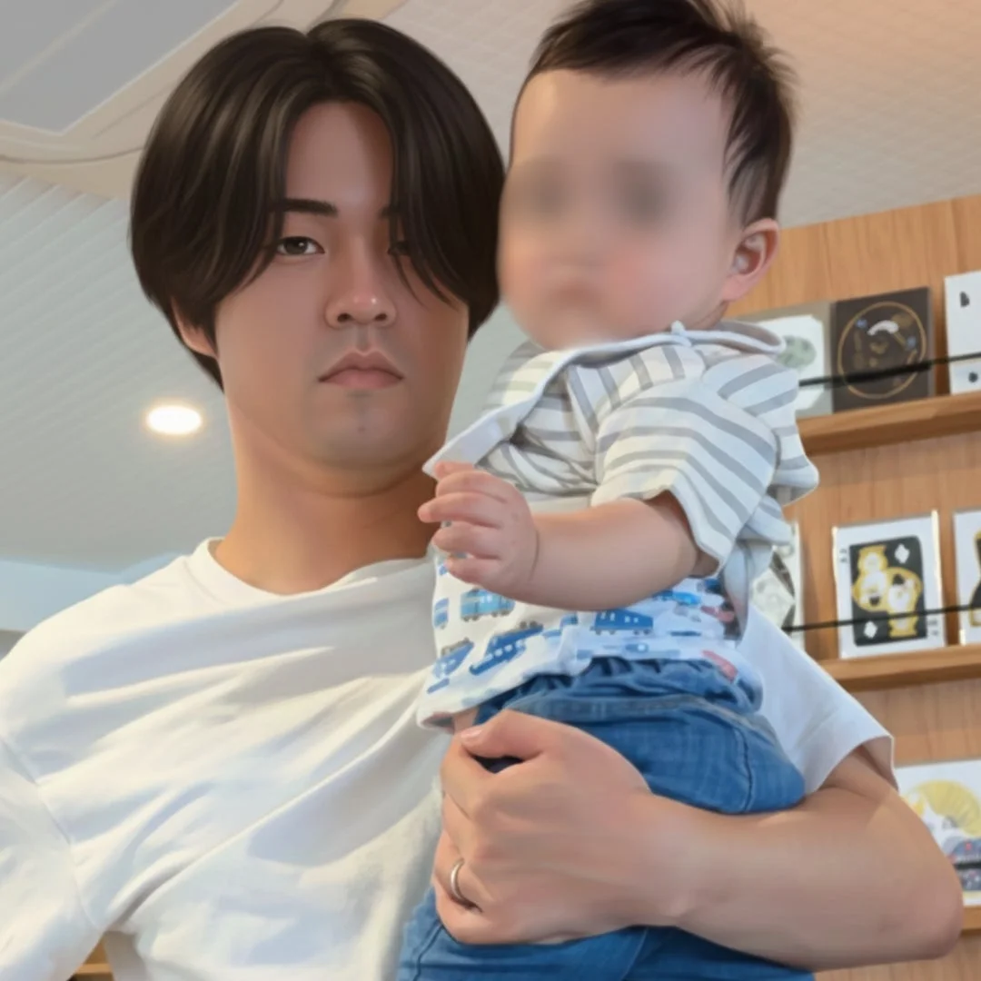 赤ちゃんを抱っこする男性