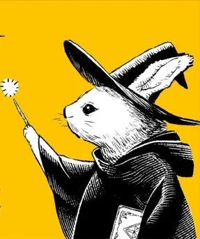 魔法使いの帽子とローブを身につけた白いウサギのイラスト